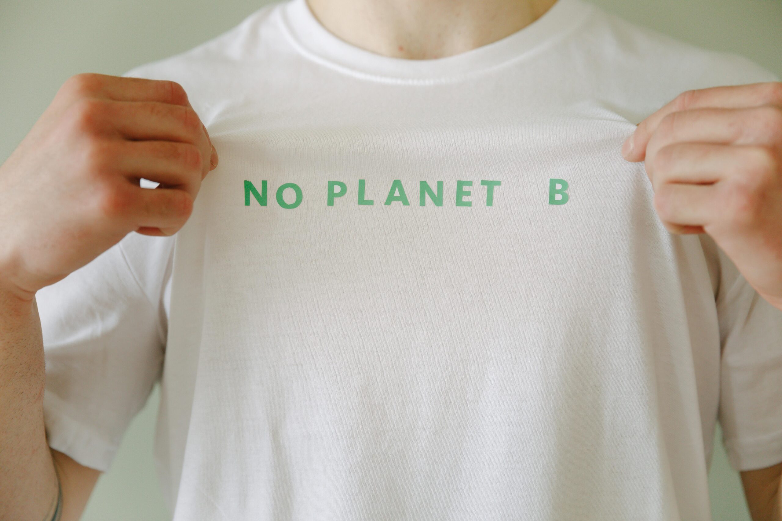 White t-shirt with 'No Planet B' slogan promoting environmental awareness.